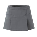 Charcoal gray A-line tailored skort with structured front knife pleats and clean waistband construction