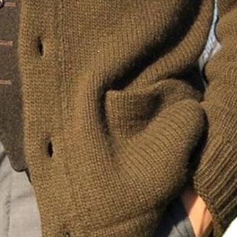 Close-up texture detail of the MontQuant heavy-gauge knit jacket in Khaki, highlighting the premium horn-textured button and dense weave structure.