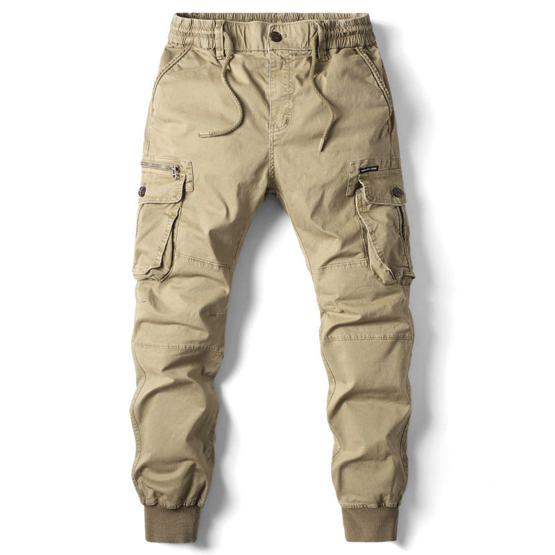 Front view of the MONTQUANT Elastic Cuff Cargo Trousers in Khaki, showcasing the structured tapered fit, dual side utility cargo pockets, and thick elasticated ankle cuffs.