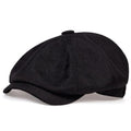 Studio shot of the MONTQUANT Textured Newsboy Cap in solid Black, showcasing a sleek, minimalist street-style headwear silhouette.
