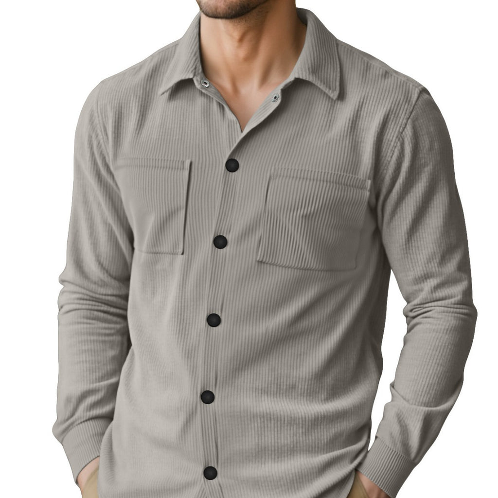 Man wearing the MontQuant Tech-Rib Knit Long Sleeve Shirt in Onyx Black, featuring a vertical micro-ribbed pattern, point collar, and utility chest pockets.