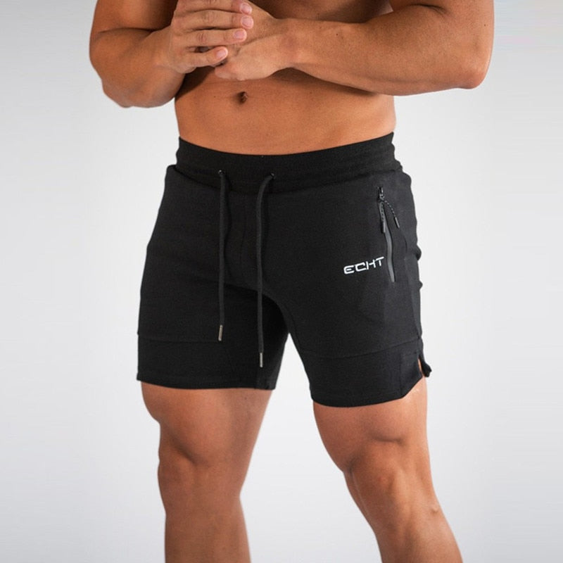 Front close-up view of the Montquant Performance Mesh Active Short in black, highlighting the athletic fit, premium adjustable drawstrings, split-hem detail, and clean branding.