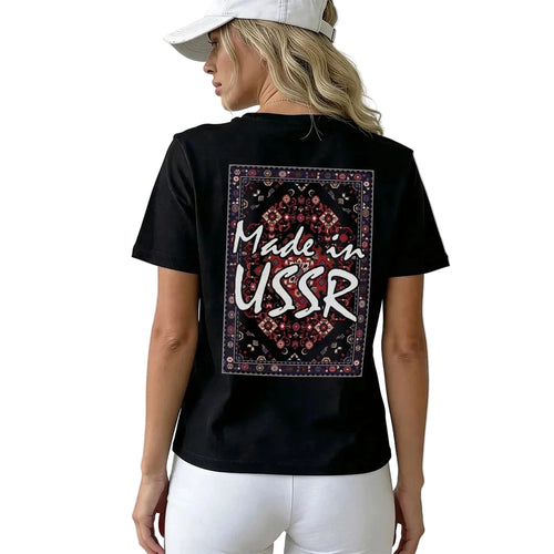 Person wearing a black t-shirt with 'Made in USSR' design on the back.