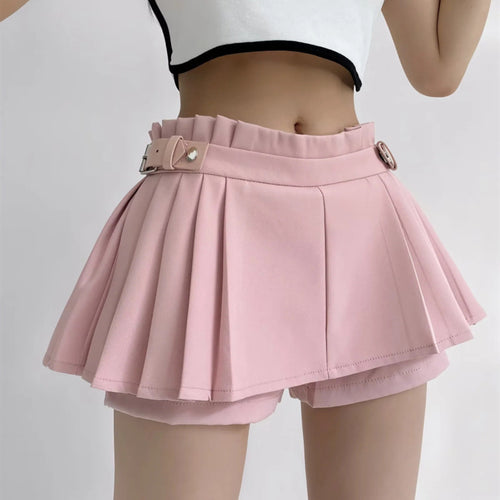 The light pink pleated skort shown on a model from the waist down.