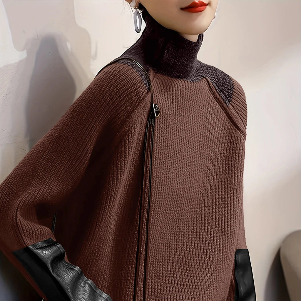 Front view of woman wearing the MONTQUANT Asymmetric Patchwork Knit Pullover in brown with black faux-leather sleeve accents.