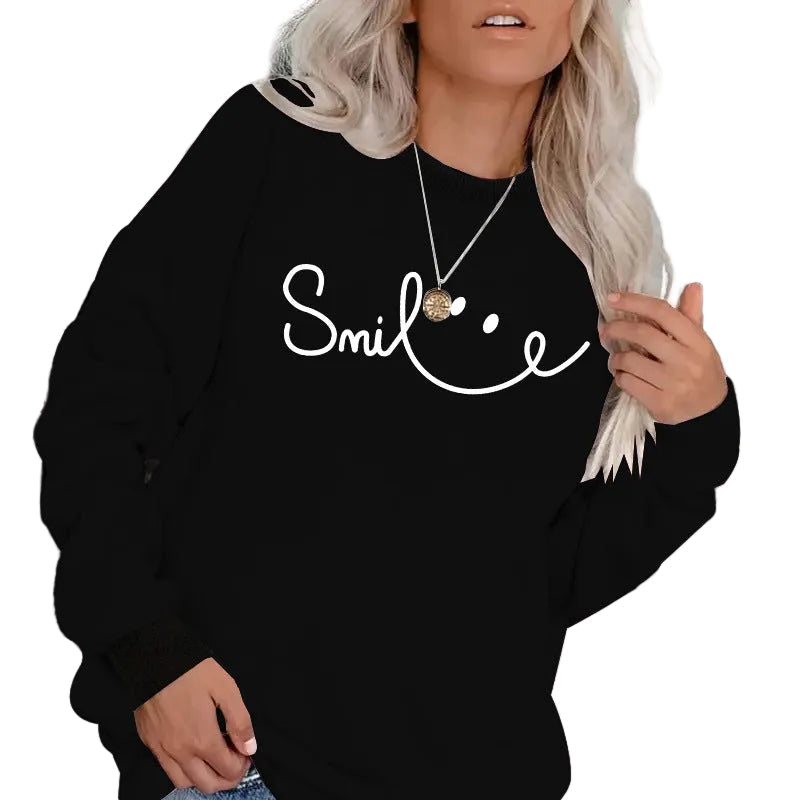 Model posing in the Onyx Black Smile graphic sweatshirt highlighting its relaxed streetwear drape.