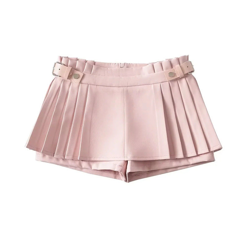 Studio flat lay of the light pink pleated skort against a white background.
