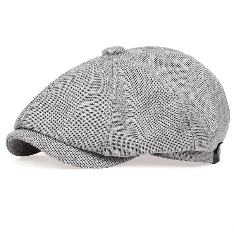 Profile shot of the MONTQUANT classic newsboy cap in a heathered Light Grey colorway.