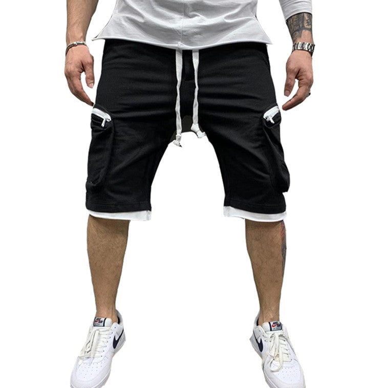 Isolated front view of the MONTQUANT Layered Fitness Cargo Shorts in solid Black, showcasing a sleek, all-dark minimalist sportswear silhouette.