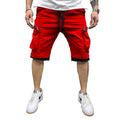 Front view of the MONTQUANT Layered Fitness Cargo Shorts in vibrant Red, showcasing the prominent vertical zippered side pockets, white drawstring cords, and black contrast layered under-hem.