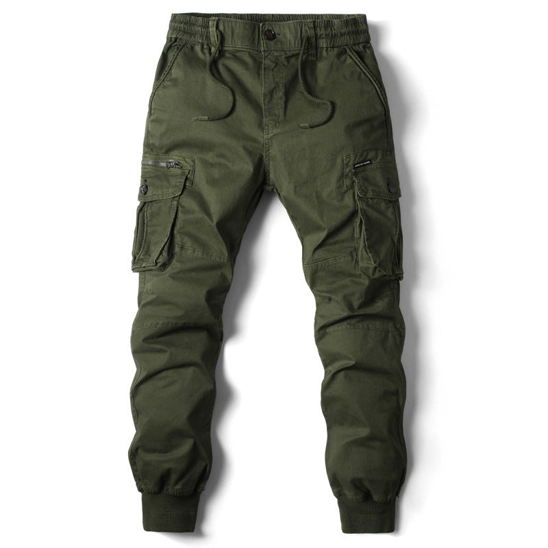 Front studio shot of the MONTQUANT Elastic Cuff Cargo Trousers in Military Green, emphasizing the balanced utilitarian pocket symmetry.