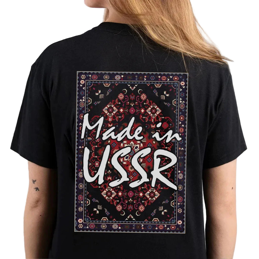 Black t-shirt with 'Made in USSR' design on the back, worn by a person.