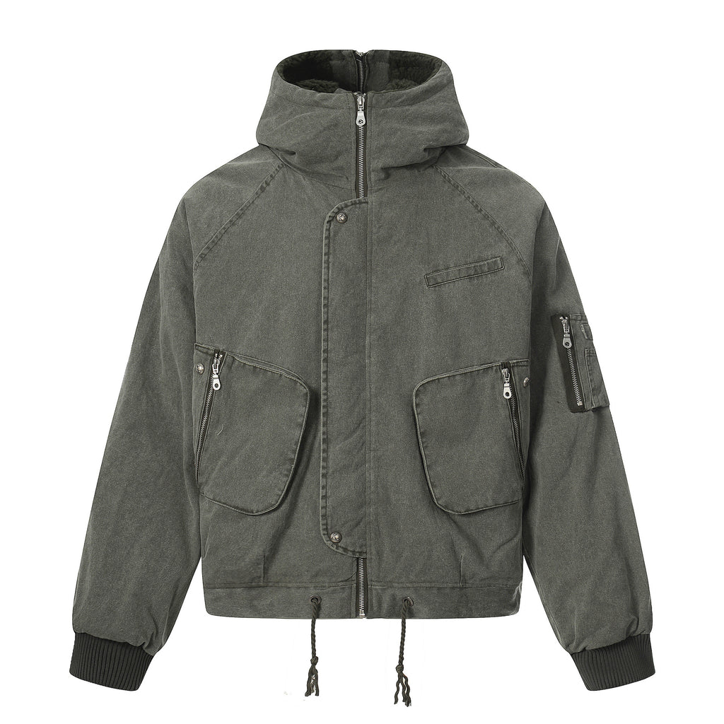 Side profile view of the washed olive green Hooded Jacket, showcasing the generous hood construction, arm paneling, and sturdy canvas texture.