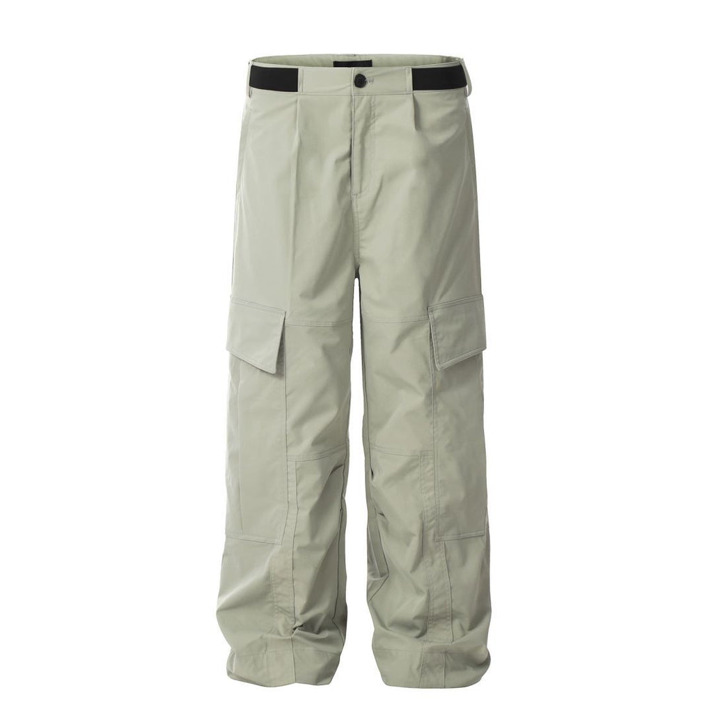 Full-length studio presentation of the MONTQUANT technical straight leg trousers in Gray Green, showcasing panel composition down the leg.
