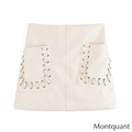 Beige poplin long skirt with prominent lace-up grommet detailing running down the front panels by MontQuant