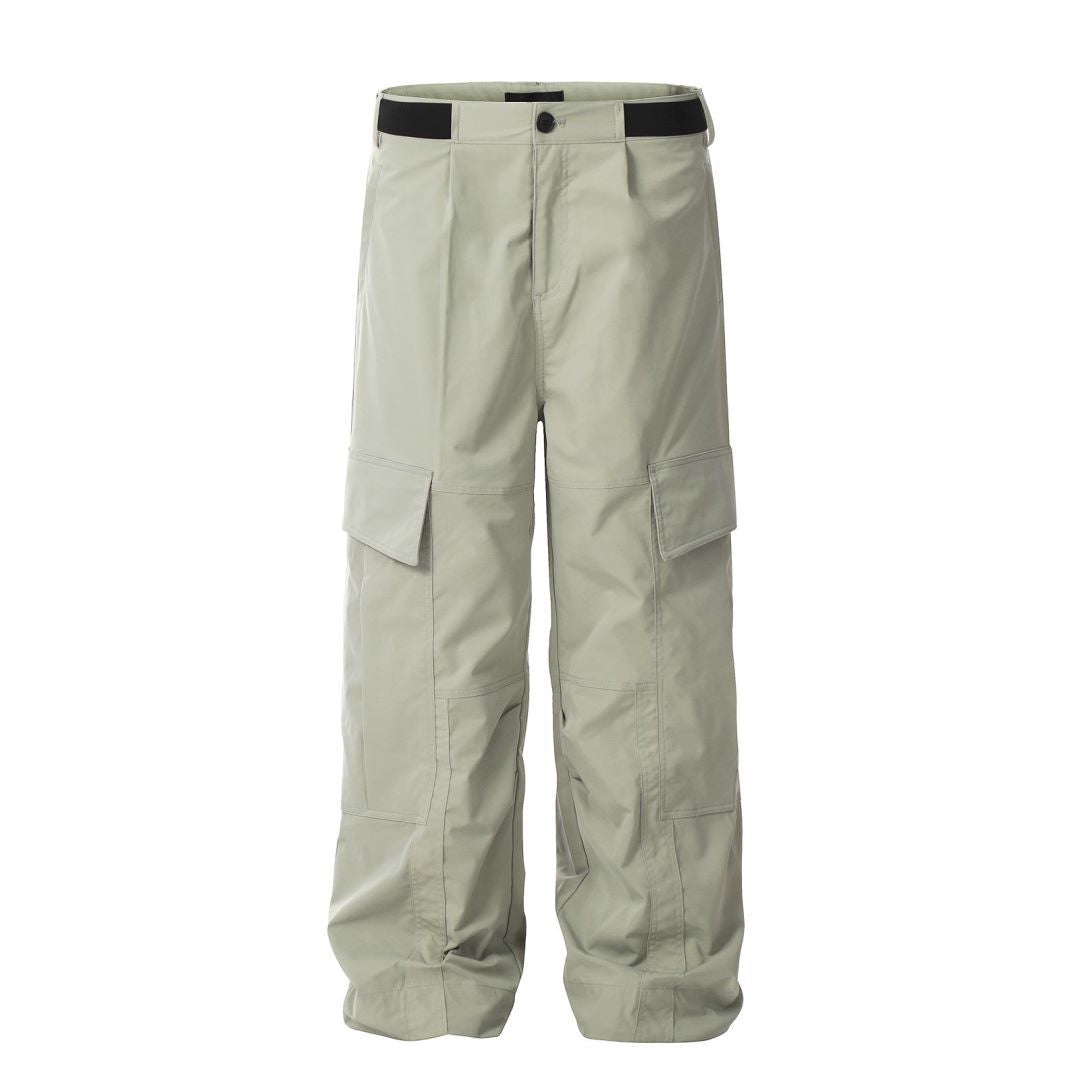 Front studio view of the MONTQUANT Straight Outdoor Trousers in Gray Green, showing the sharp straight-leg silhouette, clean waistline, and inset side cargo pockets.