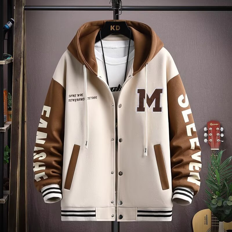 Front view of the MONTQUANT Heavyweight Varsity Hoodie Jacket in Off-White, showcasing contrasting brown sleeves, white snap-button closures, side pocket details, and graphic typography embroidery on the sleeves.