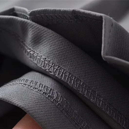 Close-up of the finished hem stitching on the internal grey shorts lining.