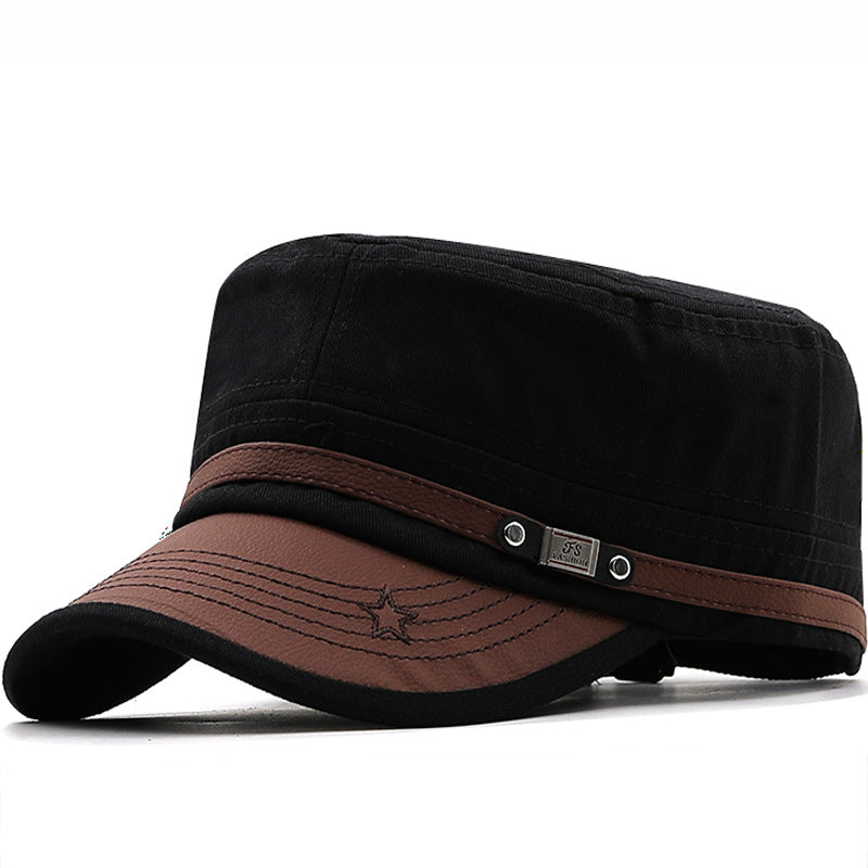 MontQuant tech-cotton flat top field cap in Onyx Black featuring a structured crown, a contrasting dark brown faux-leather curved brim with decorative star stitching, and a metallic side utility emblem.