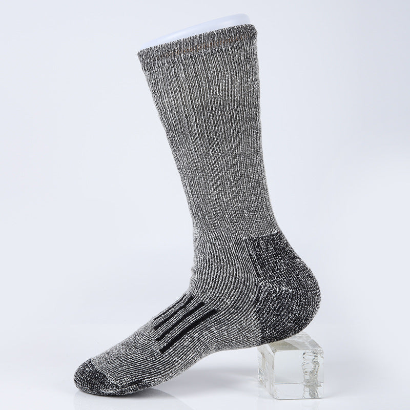 Studio presentation of the MONTQUANT Merino Wool Sock in Charcoal Gray, illustrating the dense, multi-density knit material composition.