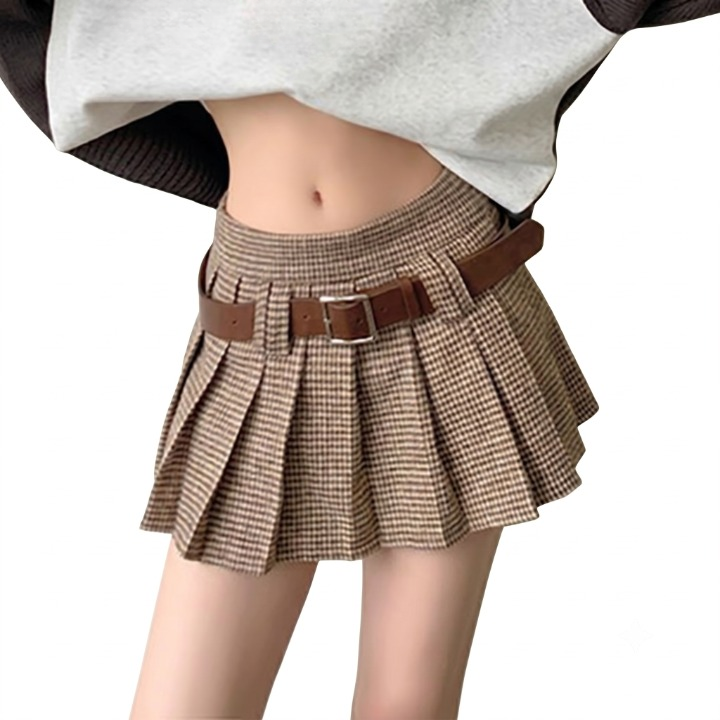Model wearing the pleated houndstooth mini skirt paired with a cropped sweatshirt and beret