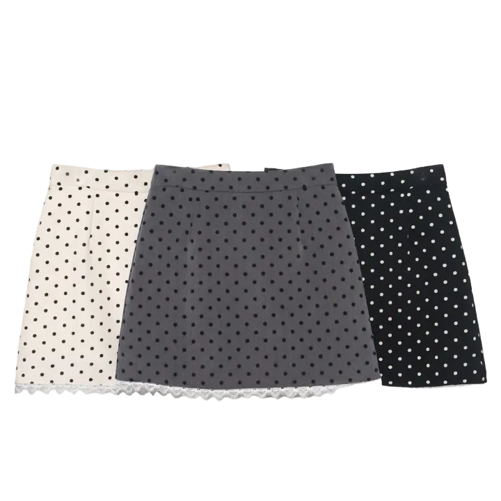 Group display showing the polka dot skirt color options including white, grey, and black