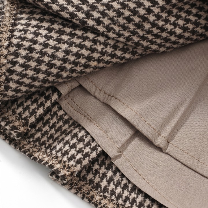 Full-length styling view of the brown a-line houndstooth pleated schoolgirl skirt